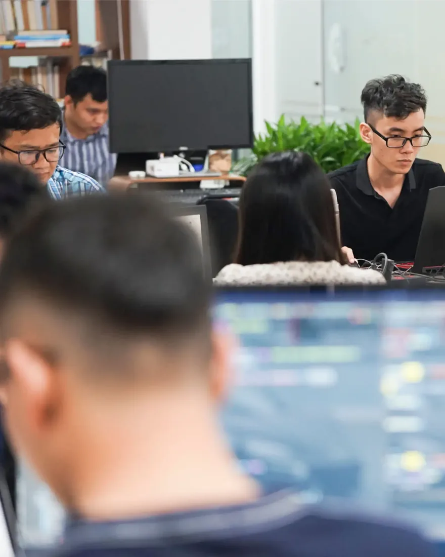 InApps engineers at their desks in the Ho Chi Minh City office
